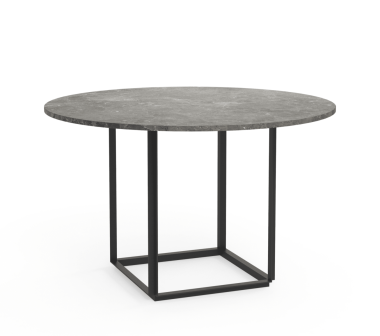 Et rundt bord med en mørkegrå betonplade og en minimalistisk sort metalbund, placeret på en almindelig hvid baggrund. Dette stykke er indbegrebet af moderne design.
