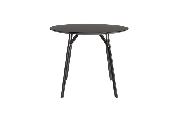 Et moderne rundt bord med en matsort plade og tynde, let spredte sorte metalben, isoleret på en hvid baggrund - et perfekt stykke designermøbel.