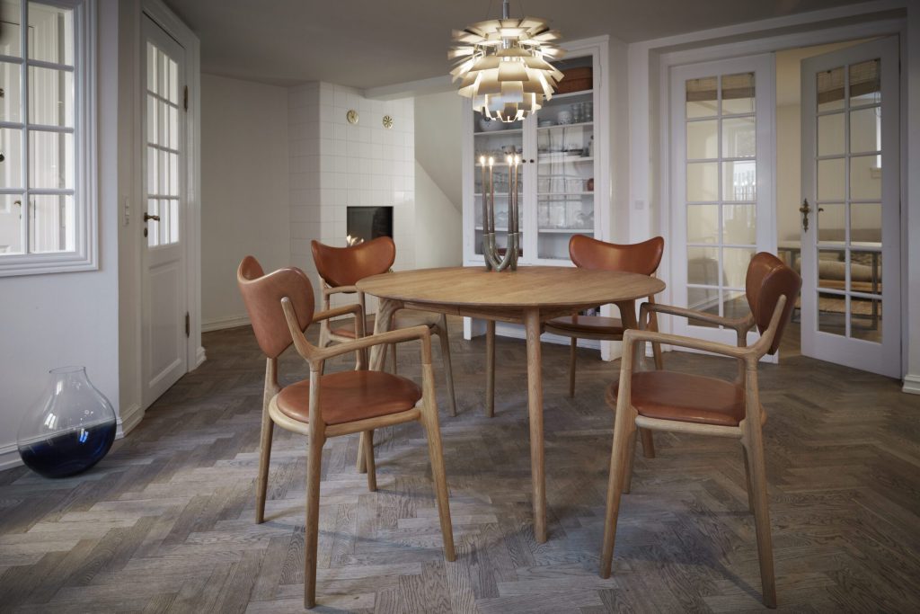 En moderne spisestue med et rundt træbord med seks stole, sildebenstrægulv, hvide vægge og en unik sfærisk lysekrone. glasdøre fører til et tilstødende rum.
