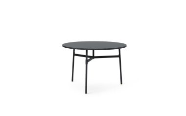Et rundt, sort NORMANN COPENHAGEN - Union Spisebord Ø110 med et minimalistisk design, med tynde metalben på en almindelig hvid baggrund.