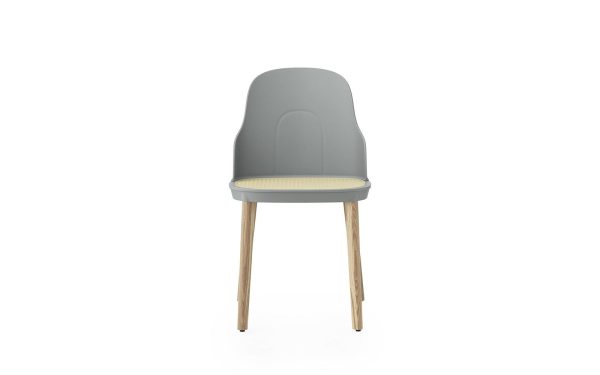 En moderne stol med gråt plastikryglæn og sæde med en beige hynde, understøttet af fire træben, på hvid baggrund fra TomorrowsDesign.