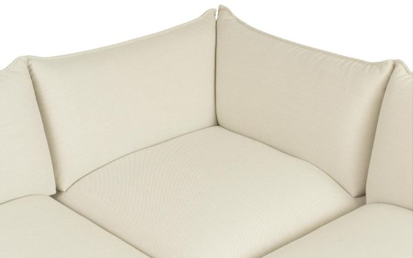 Et nærbillede af en NORMANN COPENHAGEN - Ark Modular Sofa 150 Hjørne med tekstureret polstring og let skrå hynder.