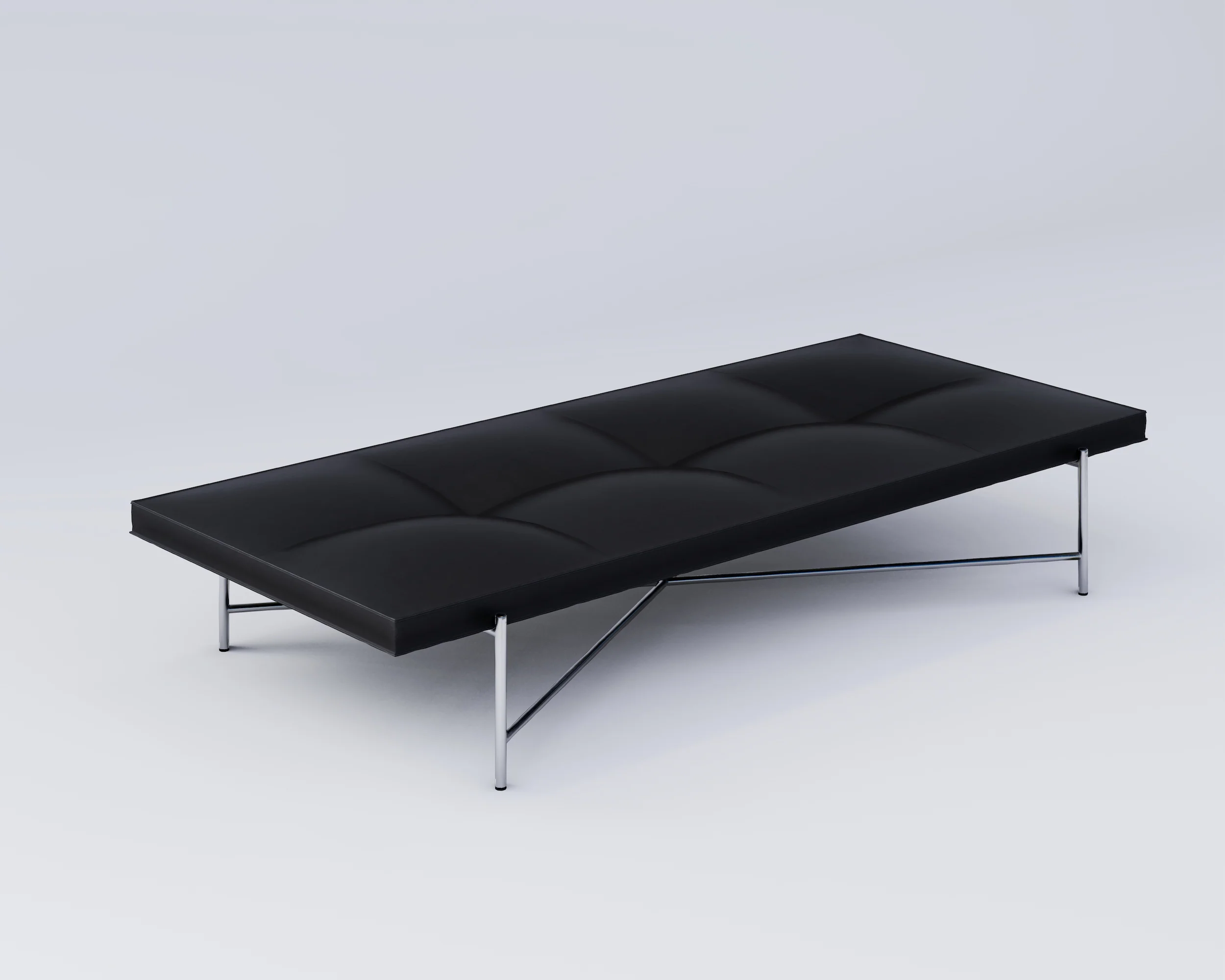 A HANDVÄRK - Daybed med minimalistisk metalramme, sat mod en almindelig lysegrå baggrund. Daybeden har et tuftet polstringsdesign.